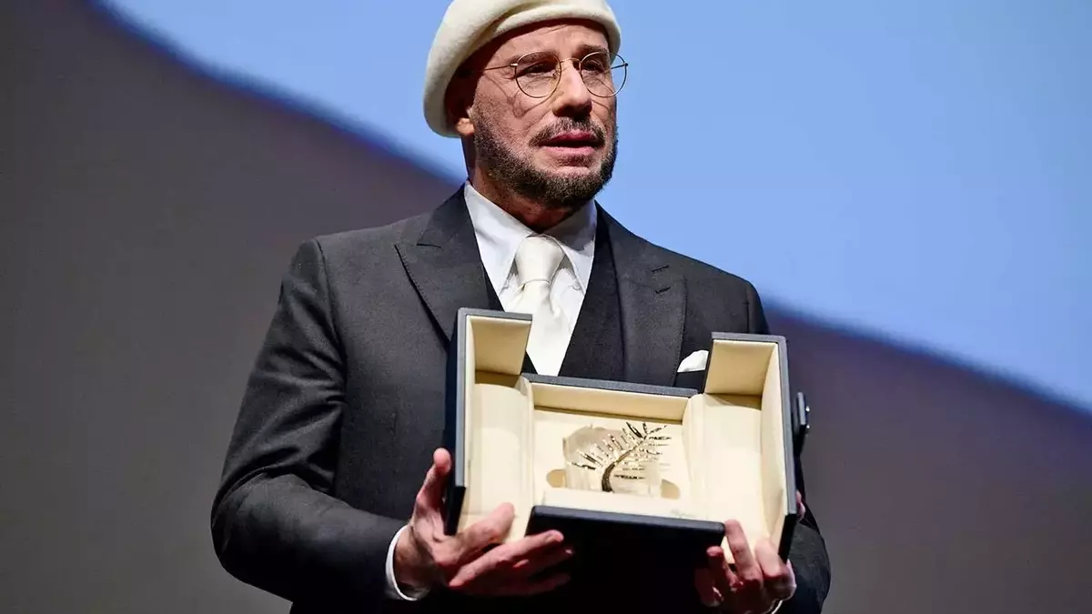 John Travolta's Emotional Acceptance of the Honorary Palme d'Or at Cannes