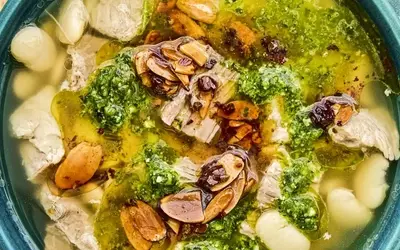Mexican Brothy Beans with Pork, Salsa Macha, and Cilantro Pesto