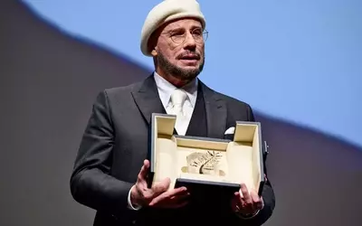 John Travolta's Emotional Acceptance of the Honorary Palme d'Or at Cannes